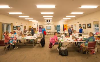 The quilters hard at work in the Rotary Clubhouse. Steve Demeranville photo