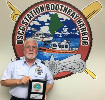 East Boothbay resident Ted Chatham is shown with “USCG Auxiliary Division 2 Auxiliarist of the Year” plaque, which he received Thursday, Oct. 11 at the October Flotilla 25 meeting at CG Station Boothbay Harbor. CG Auxiliary Division 2 includes flotillas in Portsmouth, Saco, Portland and Boothbay Harbor, and represents a total membership of over 200. Photo by Bruce MacCormac, Coast Guard Auxiliary