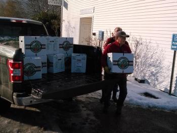 Volunteers unload trucks filled with Thanksgiving dinner items. JANE CARPENTER/Boothbay Register