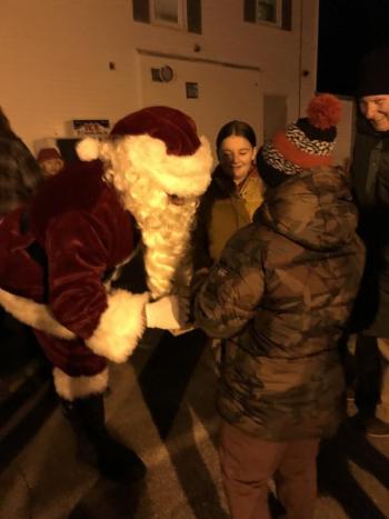 Santa reaches into his bag. KELLIE BIGOS/Boothbay Register