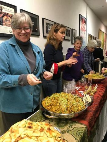 Denise Demeter, Eventide Specialties co-owner, serving Indian fare at the pilot premiere. Cherie Scott photo
