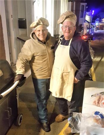 The grill masters at the sidewalk barbecue outside Janson’s Clothing Store. STEVE EDWARDS/Boothbay Register