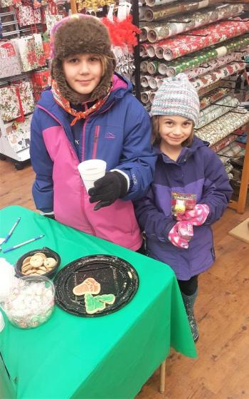 Ella, left, and Kayla Watts enjoy some hot chocolate and cookies at Sherman’s. STEVE EDWARDS/Boothbay Register