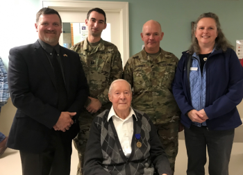 Acting Director, David Richmond from the Maine Bureau of Veterans’ Services, Maine National Guard Historian, Jonathan Bratten, Maine National Guard Command Chief Warrant Officer, David Cheney, and Maine Bureau of Veterans’ Services, Director of Strategic Partnerships, Sarah Sherman, with Corporal West at his World War II Recognition Ceremony. Courtesy of Sarah Sherman