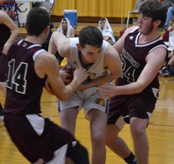 Boothbay sophomore Ben Pearce battles against two Richmond players Dec. 20 as the Seahawks rolled over the Bobcats, 63-34, at Porter Memorial Gymnasium. BILL PEARSON/Boothbay Register