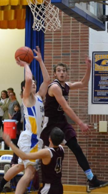 Seahawk guard Brett Hollowell drives against two Richmond defenders Dec. 20 in Boothbay’s fifth win of the season. BILL PEARSON/Boothbay Register