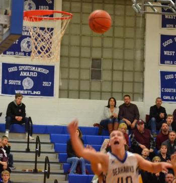 Boothbay forward Hunter Crocker jumps for a rebound Dec. 14 as the Seahawks won their third straight game to start the season, defeating Monmouth, 66-63 at Porter Memorial Gymnasium. BILL PEARSON/Boothbay Register