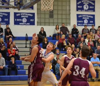 Boothbay forward Nicholas Morley looks for a rebound in the Seahawks’ 66-63 victory over Monmouth. BILL PEARSON/Boothbay Register