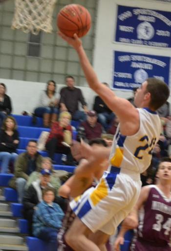 Boothbay senior Steve Reny scores two of his game high 27 points Dec. 14 against Monmouth. BILL PEARSON/Boothbay Register