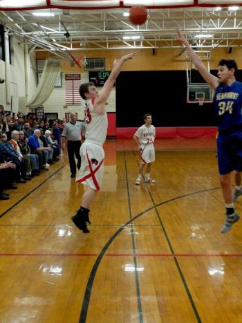 Haiden Dunning attempts a shot over Boothbay’s Ben Pearce. PHIL DI VECE/Wiscasset Newspaper
