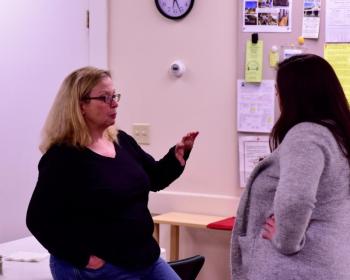 Rep. Holly Stover, left, talks with an unidentified woman at the supper. Bob Crink photo