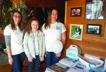 New York Life Agents Heather Reynolds, far left and Kyndall Schmidt, far left, with Suzie Edwards at the start of the event on Dec. 30. STEVE EDWARDS/Boothbay Register