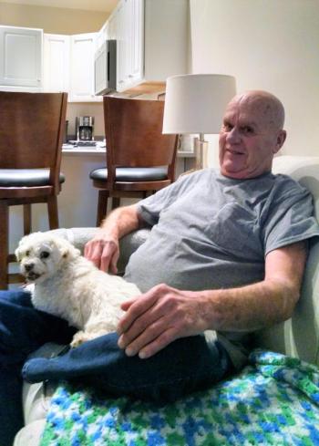 Fogg and his dog Squirt relax in their temporary housing provided by the Boothbay Harbor Country Club. MARGARET HOFFMAN/Boothbay Register