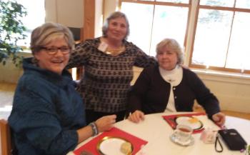 Chairman Connie Heroy, center, welcomes Jane Good, left, and Gale Jourdet, right, at the second annual St. Columba’s tea. JANE CARPENTER/Boothbay Register