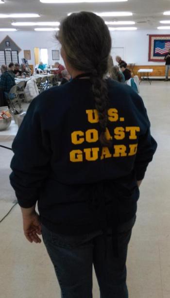 Sharon Machon, a veteran of almost 29 years in the Coast Guard, shows her support. JANE CARPENTER/Boothbay Register