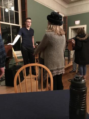 Benjamin Rumney sets up the sound system. KELLIE BIGOS/Boothbay Register