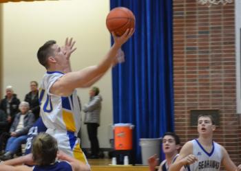 Seahawk forward Hunter Crocker soars for two his eight points in Boothbay’s 101-36 win over Mountain Valley Conference foe Telstar. BILL PEARSON/Boothbay Register
