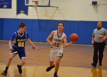 Boothbay guard Sullivan Rice makes a pass Jan. 31 as the Seahawks won their 13th game beating Mount Abram 81-55. BILL PEARSON/Boothbay Register