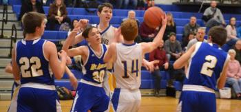 Boothbay guard Kaleb Ames (No.14) battles for a loose ball in the Seahawks’ 13th victory of the season Jan. 31. BILL PEARSON/Boothbay Register