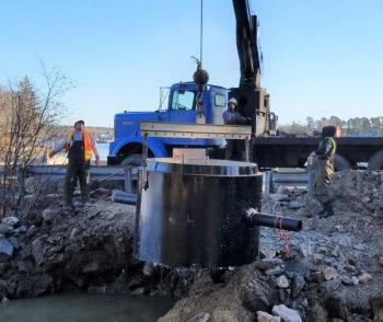 December 13, 2018: A crane lowers a manhole cylinder into place. Merritt Blakeslee photo