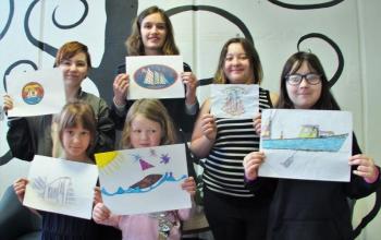 Six of the eight students who submitted designs for the first WJD T-shirt design contest and their entries: front, from left: Megan Higgins, Pauline Nadeau-MIller; back, left: Amber Johansen, Grace Campbell (with the chosen design), Maya Pangburn and California Brown. Missing from photo: Keana Pitcher and Bobby Clarkson. LISA KRISTOFF/Boothbay Registser