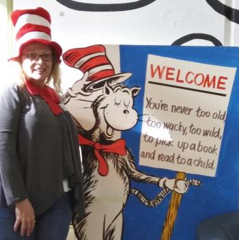 Capturing the spirit of the day, state representative Holly Stover dons her hat before reading to students. JANE CARPENTER/Boothbay Register