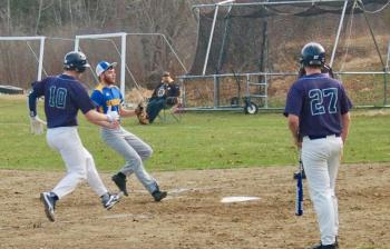 A Dirigo player comes home on a passed ball. ART MAYERS/Boothbay Register