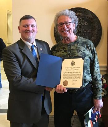MBVS Director David Richmond presents Barry Sherman with a certificate in celebration National Vietnam War Veterans Day. Sarah Sherman photo