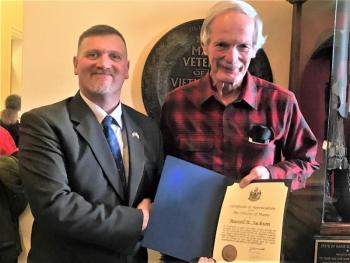 MBVS Director David Richmond presents Russell Jackson with a certificate in celebration National Vietnam War Veterans Day. Jim Singer photo