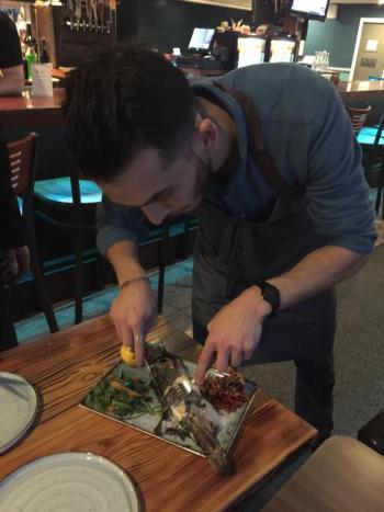 Erman serves Mediterranean bass. KELLIE BIGOS/Boothbay Register