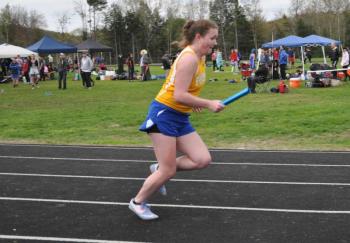 Riley Sullivan pushes through a leg of the 4x400m relay. Courtesy of Kerrin Erhard