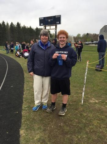 Eighth grader Kayden Ames has benefited from Coach Mame Anthony’s tutelage in recent years. Ames won all three events —shot put, turbo javelin and discus — May 23 at the middle school meet in Waldoboro. Courtesy photo