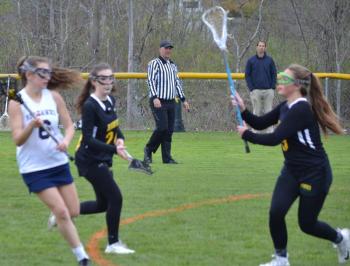 Boothbay’s Chloe Arsenault looks to score against a Maranacook/Winthrop defender May 17 in the Seahawks’ 10-7 home victory.BILL PEARSON/Boothbay Register