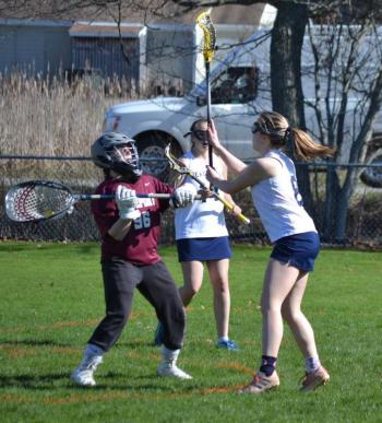 Boothbay’s Hannah Cola defends Freeport’s goalie from passing on May 6 in the Lady Seahawks’ 19-9 loss against Freeport. BILL PEARSON/Boothbay Register