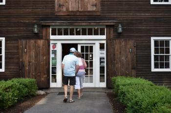 A couple strolls into Michael Dunn Antiques on Middle Street. PHIL DI VECE/Wiscasset Newspaper