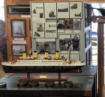 Bowdoin kiosk behind the Titanic model. The “unsinkable” ship had Maine passengers onboard. LISA KRISTOFF/Boothbay Register