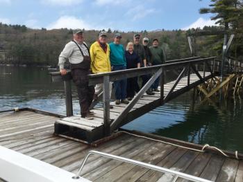 Coastal Rivers volunteers and staff made short work of installing the dock at Dodge Point on May 21. The reconstructed pier can be seen in the background. Just in time for boating season, the dock at Dodge Point is installed for the summer. The dock is open for public use and is a popular spot for picnics or to reach the hiking trails by boat. Courtesy of Coastal Rivers