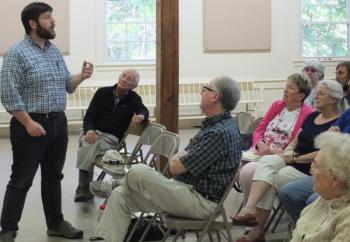 At a June 12 special town meeting in Southport, Revision Energy consultant Andrew Karl explains his firm’s recent feasibility study on how a solar panel array would save taxpayers money. BILL PEARSON/Boothbay Register