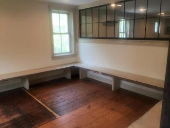The workshop room on the main floor features cool wood slab seating and a window ... by contractor Neal Groton. LISA KRISTOFF/Boothbay Register