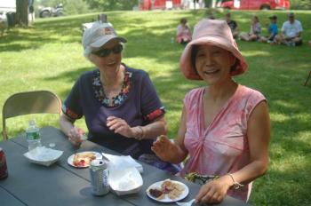 Claire Sirois, left, and Yoko Are of Richmond sample donated pies. ART MAYERS/Wiscaset Newspaper