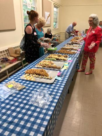 Nancy Harriman, left, and her volunteers package up cookies for attendees at Southport Country Fair. CRAIG LANCASTER/Boothbay Register Southport, Southport Country Fair, Southport Town Hall, Southport United Methodist Church