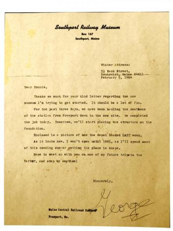 Spinney approached George McEvoy in 1964 about a job in the newly relocated Freeport Station, which was just settling into its Wiscasset Road home after long years of service in Freeport. His first letter of interest letter seems not to have survived the 55 years since its mailing, but McEvoy’s prompt response recently resurfaced in a rummage through storage boxes. His persistence as a 15-year-old seems to have paid off. Young Spinney stayed in contact with George McEvoy, volunteered, and then became the Village’s first conductor, its first paid employee. His early fascination for the Narrow Gauge trains gave way to a lifelong passion for model trains. Courtesy of Kate Steed