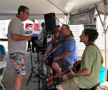 Tim Hodgdon speaks with the Holy Mackerels. JENNY BENNETT/Boothbay Register