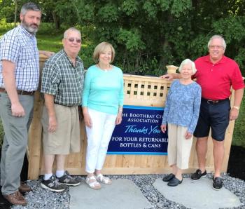 Several civic-minded people worked to find a location for a new bottle bin. Boothbay Civic Association and the Landscape Committee reached an agreement with local businessman Paul Coulombe to place it near the Boothbay Common’s new restrooms. Pictured, from left, Town Manager Dan Bryer, Tom Nickerson of the Boothbay Landscape Committee, BCA President Dawn Gilbert, Boothbay BCA member Joan Rittall, and Coloumbe. Courtesy photo