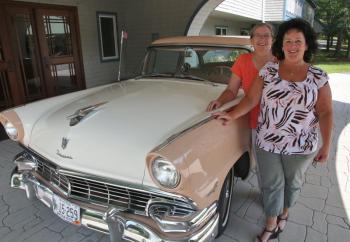 Karen Westhaver, front, executive director of Schooner Cove Retirement Community and Wanda Wilcox, executive director of Chase Point Assisted Living, pose with a 1956 Ford Fairlane, one of the many antique cars on display at the sixth annual Antique Car Show and Elvis Extravaganza Aug. 13. Courtesy of LincolnHealth