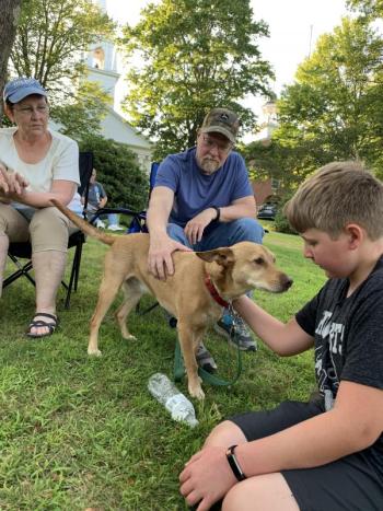 Woolwich’s Marilyn Sprague looks on as husband Gary Sprague and their grandson Wesley Leeman, 12, pat the family’s Carolina dog Merle. SUSAN JOHNS/Wiscasset Newspaper