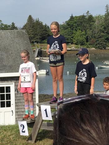 The winners of the Girls’ Race, ages 9-11, first place Sage Wickline, second place Cora Cusack, and third place Sabrina Fairfield. JENNY BENNETT/Boothbay Register