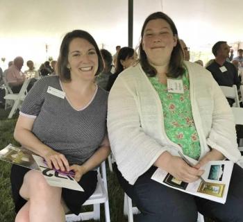 Valerie Young, left, and Margaret Hoffman get ready to bid at the auction. Courtesy of BRLT