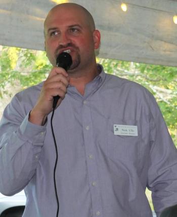 Boothbay Region Land Trust Executive Director Nick Ullo addresses the 194 guests attending the Aug.8 art auction at Oak Point Farm. BILL PEARSON/Boothbay Register