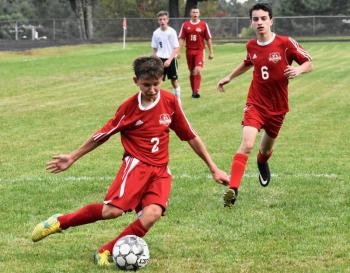 Freshman Payton Blagdon with the ball got the goal that sent the Sept. 11 game with Carrabec into overtime. Also shown is Payton’s older brother Chance Blagdon. PHIL DI VECE/Wiscasset Newspaper